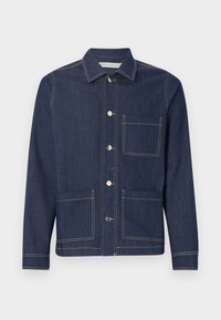 Mørkeblå denimjakke med krage, to frontlommer og kontrasterende gul søm. Har metallknapper og en klassisk passform.
