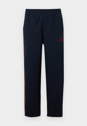 Navy sweatpants made of cotton blend with an elastic waistband. Features red "Gymnasium" logo on the thigh and side orange stripe.