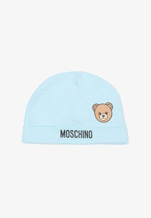 Berretto di cotone azzurro chiaro con grafica di un orso su un lato e la scritta "MOSCHINO" stampata in nero sul risvolto. Design bicolore, consistenza morbida.