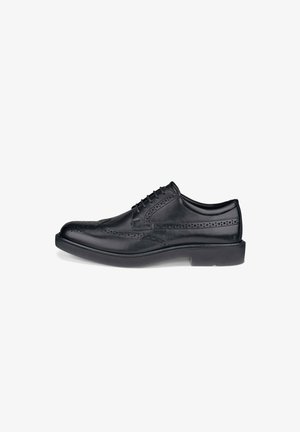 Sorte læder dress sko med wingtips-design og perforerede detaljer. Rund tå, snørebåndslukning og flad gummisål.