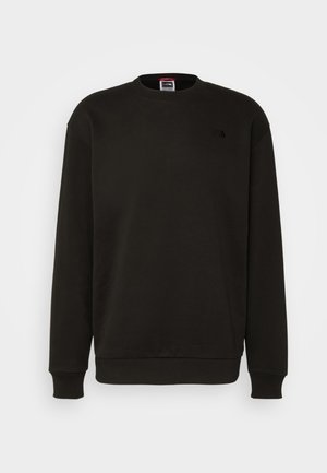 Schwarzer Pullover aus weichem Material mit Rundhalsausschnitt, gerippten Ärmelbündchen und Saum. Verfügt über ein kleines Logo auf der linken Brust.