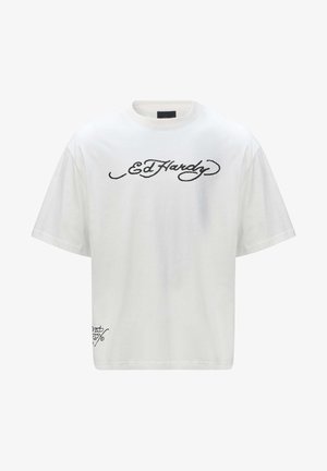 Bílý bavlněný tričko s oversized střih, na přední straně s černým textem "Ed Hardy". Krátké rukávy a klasický kulatý výstřih.