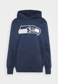 Felpa con cappuccio navy realizzata in tessuto morbido. Presenta un grande logo bianco dei Seattle Seahawks sul davanti e una tasca a canguro. Cappuccio regolabile con cordini.
