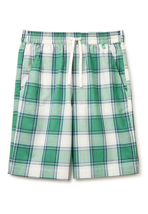 Shorts à carreaux verts et blancs avec une taille élastique et un cordon blanc, dotés de poches latérales et d'une petite étiquette de marque près de la taille.