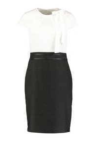 Robe à manches courtes avec un haut blanc orné d'un nœud au niveau de l'encolure et une jupe crayon noire à finition texturée et à la silhouette ajustée.