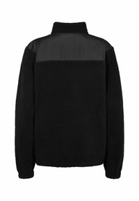 Veste en polaire noire avec col montant et panneau en tissu lisse sur le haut du dos et les épaules, manches longues et poignets élastiques.