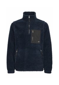 Navy fleece pullover with high collar, quarter-zip front, left chest pocket, and zippered side pockets; textured, soft fabric.