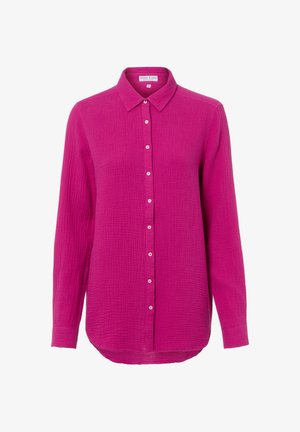Fuchsia button-up shirt with a textured, lightweight fabric. Features a classic collar and a rounded hem, with small metallic buttons down the front.