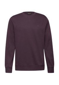 Sudadera de cuello redondo morada hecha de material suave, con mangas largas, puños y dobladillo acanalados, y un pequeño logo en el pecho.