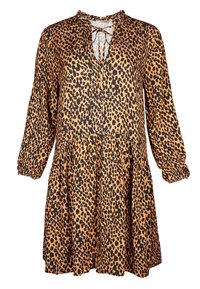 Sukienka w lwią łapę z dekoltem w kształcie V, długimi rękawami i marszczonym stanem. Wykonana z lekkiego materiału w odcieniach brązu i czerni.