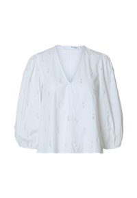 Blouse blanche à décolleté en V profond, manches bouffantes et broderie florale détaillée sur l'ensemble. Tissu léger avec une texture lisse.