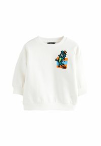 Fehér, kerek nyakú, pamut pulóver, amelyet színes T-Rex grafika díszít a mellrészen, valamint bordázott mandzsettákkal és aljjal rendelkezik.