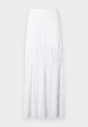 Jupe maxi blanche à volants, réalisée en tissu léger. Elle présente une ceinture élastique et une texture subtile avec des coutures horizontales.