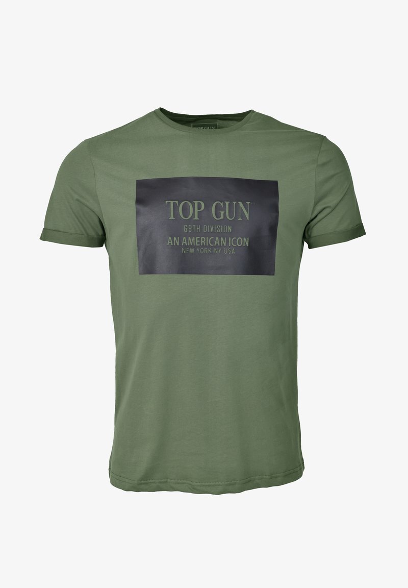 Oliwkowa koszulka z bawełny, krótki rękaw, z czarną prostokątną grafiką i białym napisem: "TOP GUN 69TH DIVISION AN AMERICAN ICON".