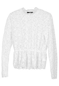 Blouse blanche à manches longues en dentelle avec des motifs floraux et un ourlet peplum, col rond et taille légèrement froncée.