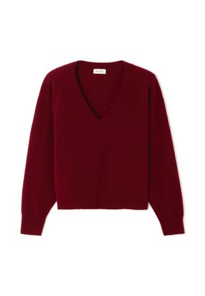 Jersey burdeos con escote en V, mangas largas y bajo recortado. Hecho de tela suave y texturizada. Diseño simple sin patrones ni elementos metálicos.