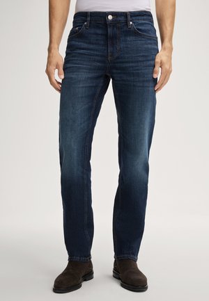 Dark blue denim jeans with a straight-leg cut, featuring front pockets and a button closure, displaying subtle fading and stitch detailing.