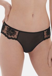 Black underwear with sheer mesh and embroidered floral detailing on the sides, featuring a scalloped edge and soft texture.