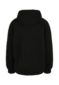 Veste polaire noire à capuche vue de dos, avec des manches longues et un tissu doux et texturé.