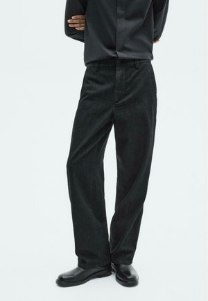 LIMITED EDITION WIDE - Trousers - black