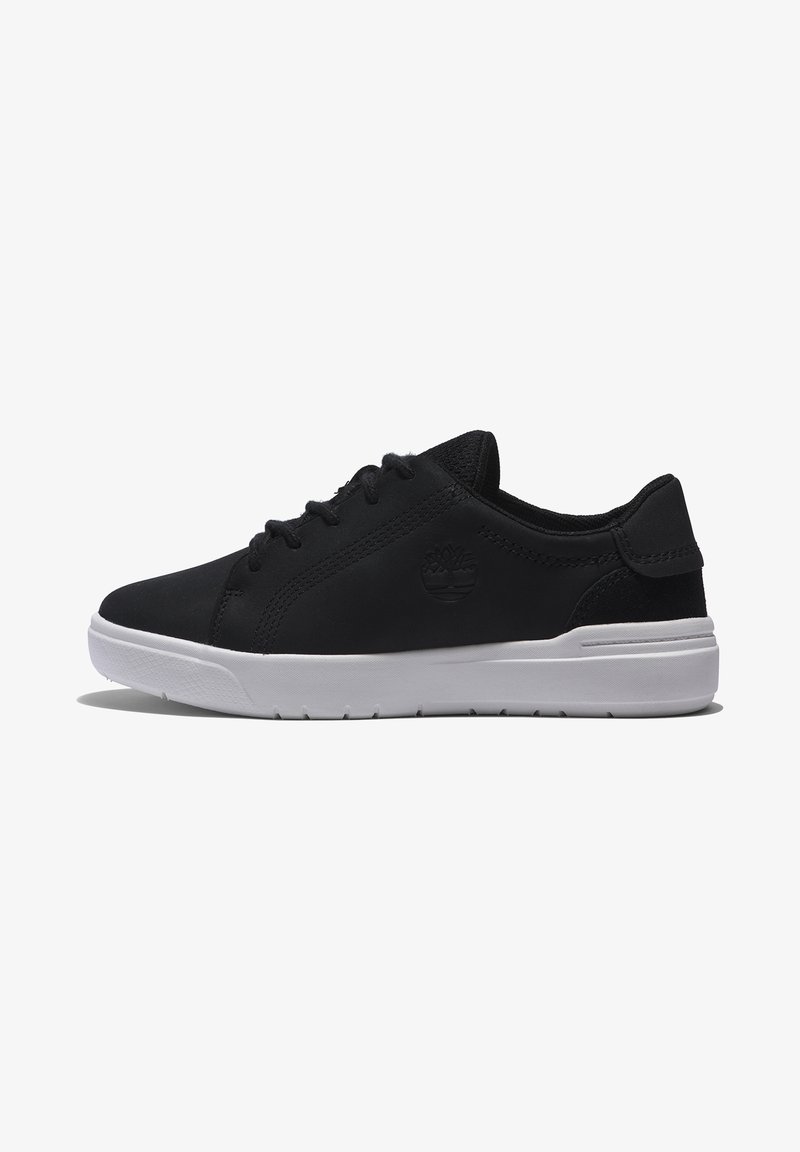 Black sneaker with a smooth upper, featuring a logo, white sole, and lace-up design; texture appears soft and durable.