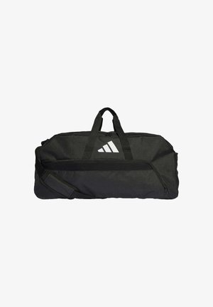 Svart duffel bag laget av slitesterk stoff, med en glidelåslomme foran, doble håndtak og justerbar skulderrem med en hvit logo.