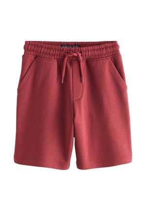 Pantaloncini in misto cotone rossi con elastico in vita, coulisse e due tasche laterali. Tessuto liscio e senza motivi visibili.