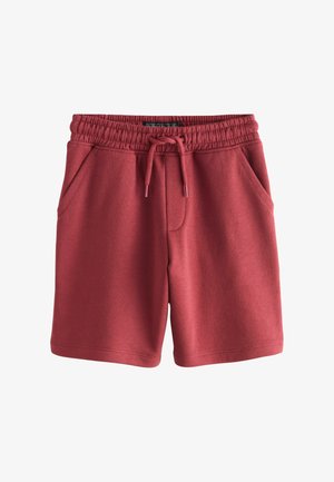 Røde shorts i bomuldsblanding med elastik i taljen, snøre og to sidelommer. Glat tekstur uden synlige mønstre.