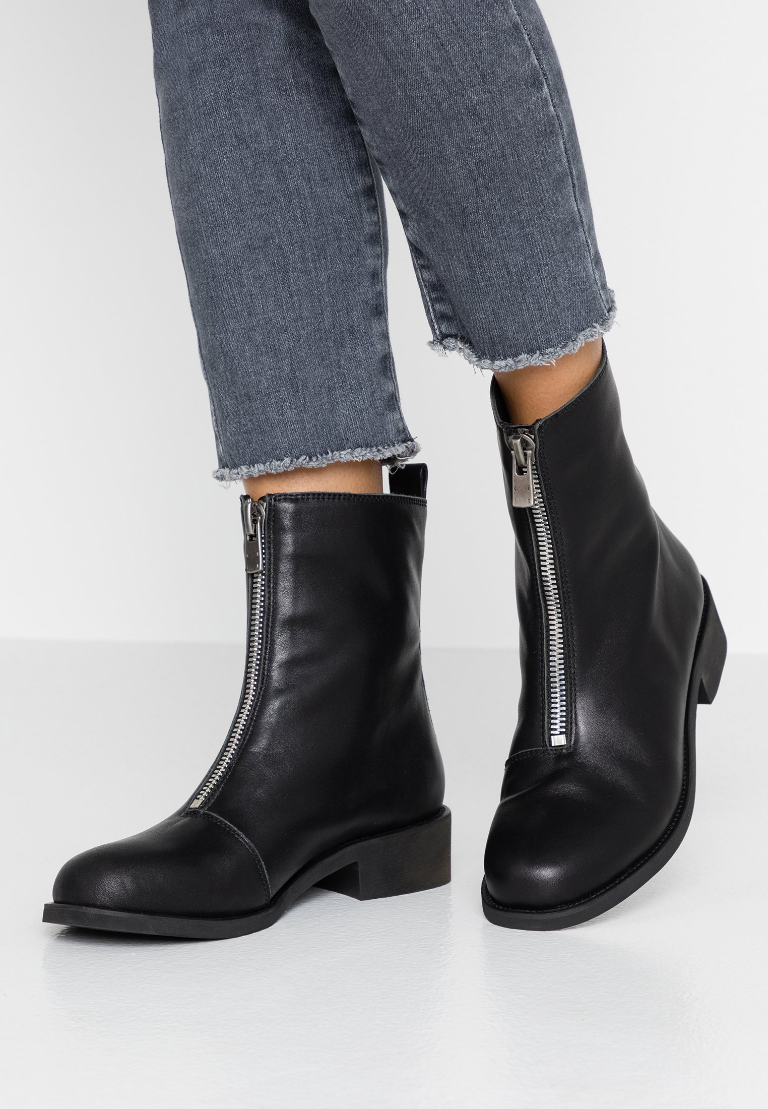 black zip front ankle boots