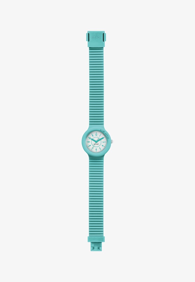 Une montre en silicone turquoise avec un cadran rond, un bracelet strié et un cadran blanc comportant des chiffres et des aiguilles noires. Boucle à l'extrémité.