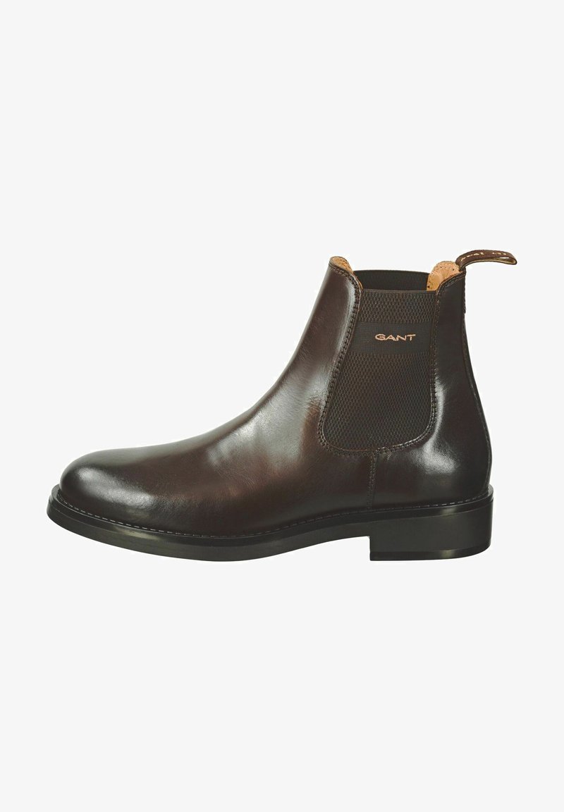 Brune lær Chelsea støvel med glat finish, elastiske sidepaneler og en lille trækflik ved hælen. Har en holdbar gummisål.