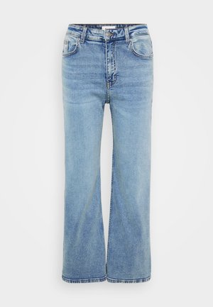 Ljusblå, vida jeans gjorda av denim. Har fem fickor, bältesöglor och en standardknapp och dragkedjestängning. Sliten textur synlig.