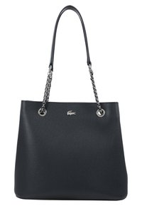 Sac fourre-tout noir texturé avec une poignée en chaîne brillante, des accents en métal argenté et un petit logo. Dispose d'un intérieur spacieux et d'une forme structurée.