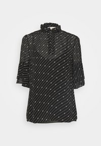 Blusa nera realizzata in tessuto trasparente con colletto arricciato. Presenta strisce diagonali bianche e piccoli motivi circolari. Maniche corte e svasate.