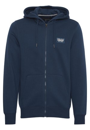 Námořnická modrá bunda na zip vyrobená z bavlněné směsi, vybavená kapucí na šňůrku, předními kapsami a malou nášivkou loga na hrudi.