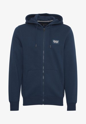 Tumed sinine tõmblukuga kapuutsiga dressipluus, mis on valmistatud puuvilla segakudumisest, uhkeldades nööriga kapuutsi, ees olevate taskute ja väikese logo plaastriga rinnal.