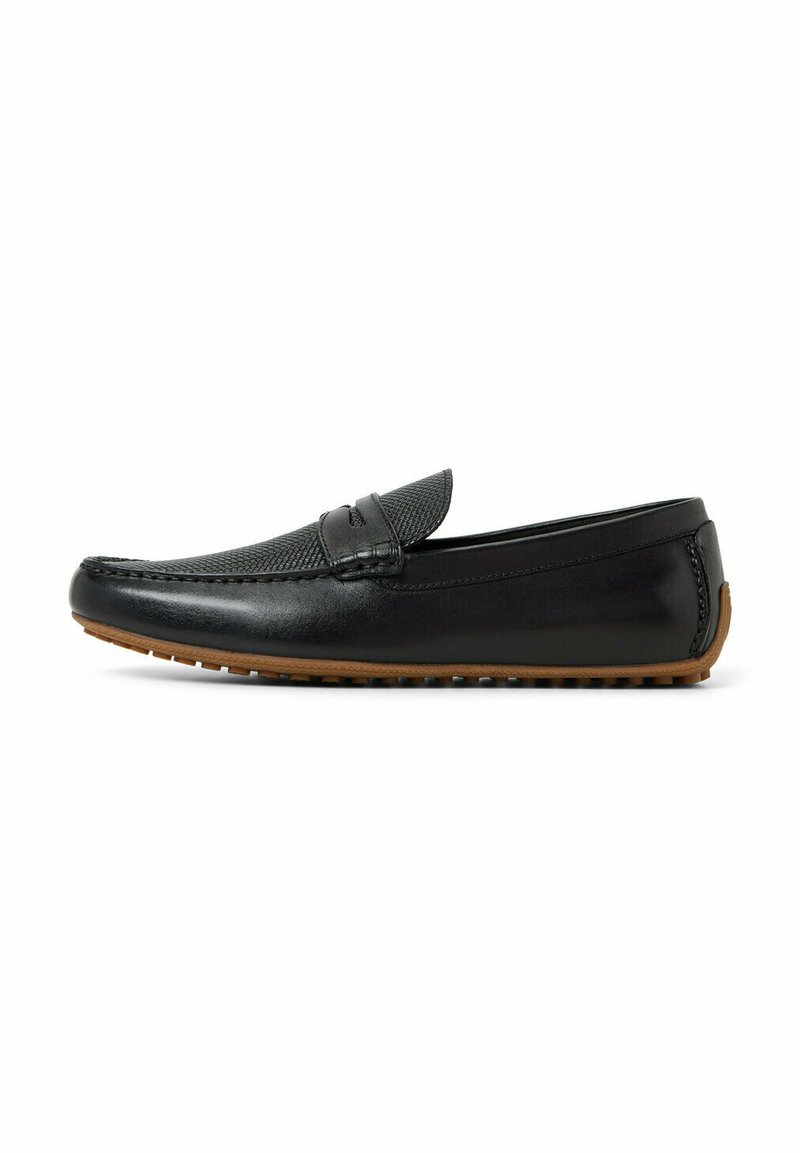 Svarta läderloafers med en texturerad mesh-panel, smal profil, rund tå och en gummisula med små nubb för grepp.