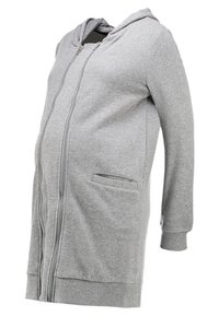 Felpa premaman grigia con zip e maniche lunghe, tasche frontali e un tessuto testurizzato e elastico progettato per il comfort.