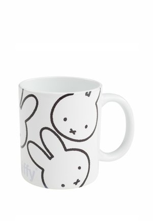 White ceramic mug with black outline drawings of simple cartoon bunny faces and ears on the side, featuring a round handle.