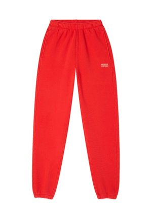 Rode sweatpants van zachte stof, met een elastische tailleband, zijzakken en een klein gedrukt logo op het rechterbeen.