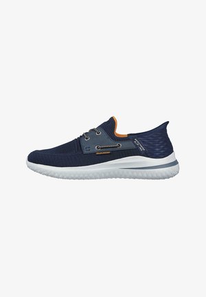Navy mesh athletic shoe with orange accents, featuring a cushioned white sole and grey detailing, designed for comfort and flexibility.