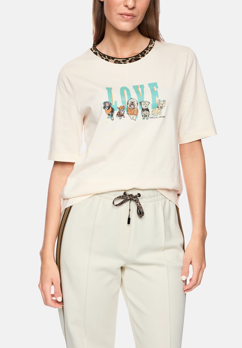 Cream t-shirt with a leopard-print collar and a colorful "LOVE" graphic featuring various dogs. Paired with light elastic waistband pants.