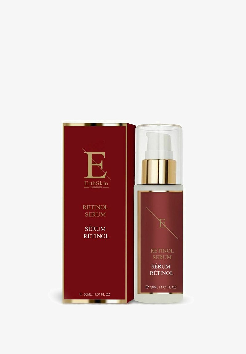 Red rectangular box with gold accents, containing a clear pump bottle of retinol serum labeled in gold and white, 30ml size.