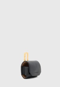 Black leather key holder with a smooth texture, curved shape, and gold hardware. Features a minimalist design and embossed branding.