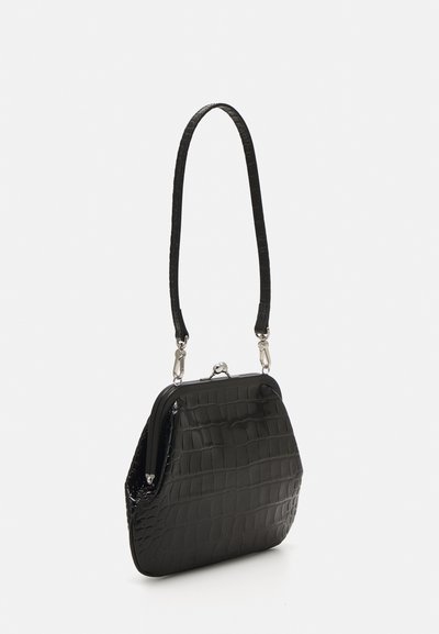 Black crocodile-embossed handbag with a curved shape, shiny texture, silver-toned hardware, and a thin, detachable strap.