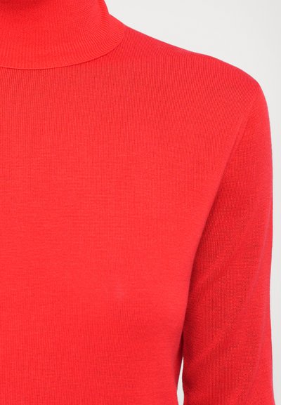 Red turtleneck sweater with a ribbed texture, fitted design, and long sleeves. Made of a soft knit fabric.