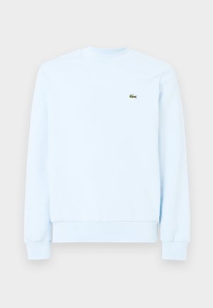 Hellblaues Sweatshirt mit langen Ärmeln und Rundhalsausschnitt, mit gerippten Bündchen und Saum, mit kleinem grünem Krokodil-Logo auf der linken Brust.