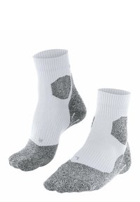 Chaussettes de compression présentant un design à rayures blanches avec des accents texturés gris. Motifs hexagonaux sur les côtés et zones de orteils renforcées.