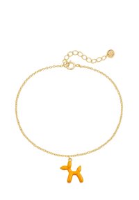 Bracelet en chaîne dorée avec un charm en forme de chien ballon orange vif, texture lisse et longueur ajustable avec un fermoir en forme de homard.