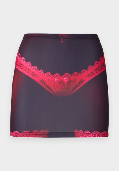 Black fabric mini skirt featuring a red lace trim at the top and hem, with a graphic print of red lace underwear on the front.
